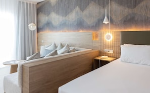 Junior Suite | Minibar, in-room safe, blackout drapes, iron/ironing board