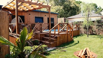 Relax on the deck with a view of the pool and surrounding lawn.