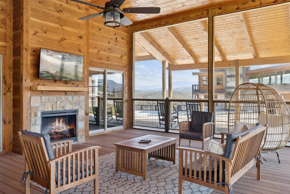 Relax in a tranquil setting with a fireplace and scenic mountain views.
