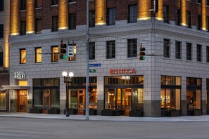 A corner building with a 'Hotel Ardent' sign, 'Bistecca' restaurant, and a 'One Way' street sign. - Hotel Ardent Dayton Downtown, Tapestry Collection By Hilton (Dayton)