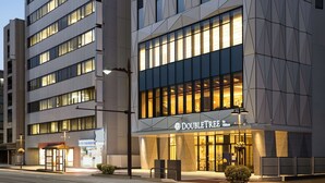 A DoubleTree by Hilton hotel with a modern facade, large windows, and a well-lit entrance. - DoubleTree by Hilton Toyama (Toyama)