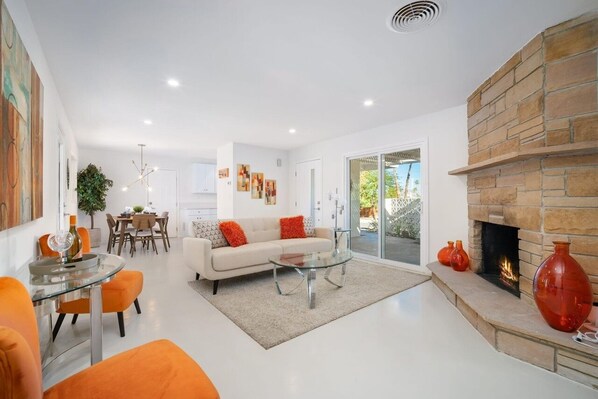 Smart TV, fireplace, books, computer monitors