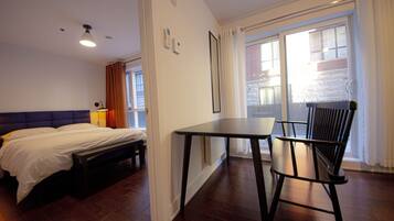 1 bedroom, desk, iron/ironing board, travel crib