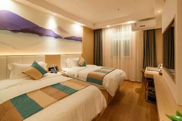 A hotel room with two beds, a desk, and a large window with curtains. - VX Xuzhou Yunlong District Normal University Yunlong Mountain Scenic Spot Hotel (Xuzhou)