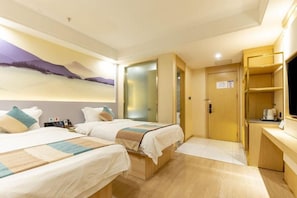A hotel room with two beds, a desk, a television, and a door leading to a bathroom. - VX Xuzhou Yunlong District Normal University Yunlong Mountain Scenic Spot Hotel (Xuzhou)