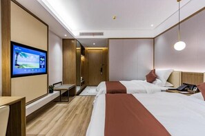 A hotel room with two beds, a TV mounted on the wall, a desk, and a bedside table. - Gya Jiaxing Haiyan County Changan Road Lishi Plaza Hotel (Jiaxing)