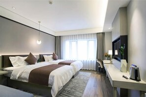 A modern hotel room with two beds, a desk, a TV, and a large window. - GYA Hotel (Shanghai Railway Station) (Shanghai)