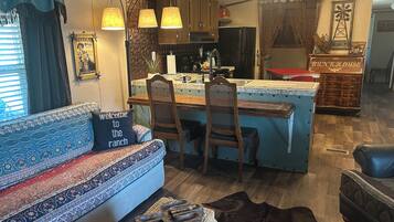 Smart TV, fireplace, books, smart speakers
