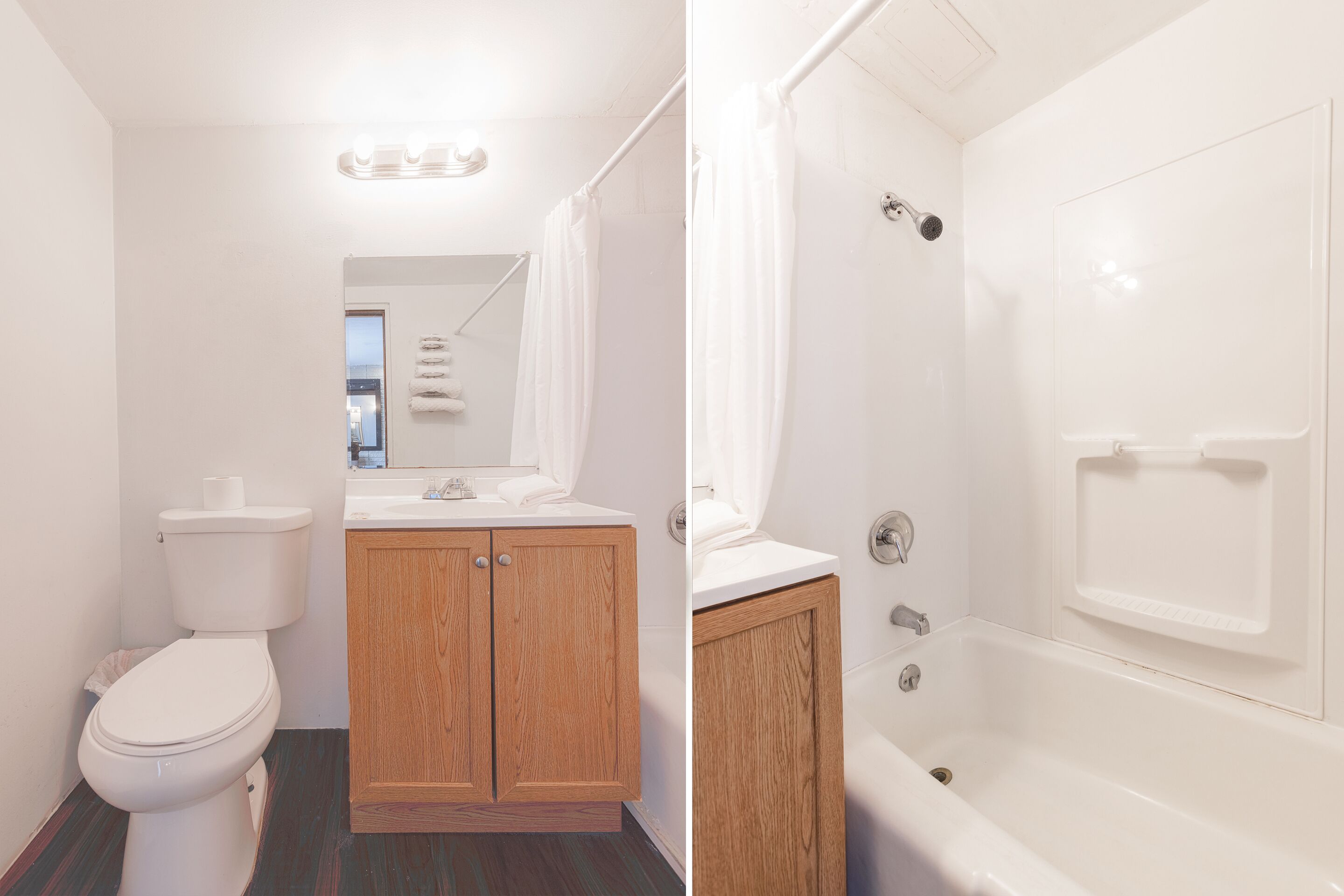 Une salle de bain comprenant des toilettes, des meubles en bois, un lavabo et une baignoire.