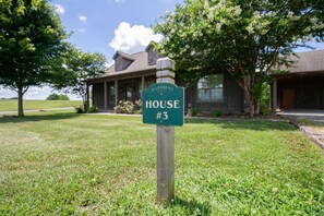 A house sign with the text "RIVERBEND HOUSE #3". - Sleeps 14 on a Duck River ranch: 4 en suite bedrooms, patio, fishing, horses (Normandy)