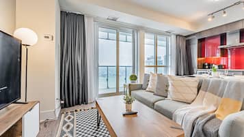 Signature Condo, 1 Bedroom, Balcony, Lake View | Living area | 50-inch Smart TV with satellite channels, TV, Netflix