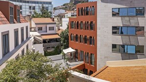 A modern building with multiple floors, large windows, and a mix of architectural styles. - In the city centre - Cine Park Residence I (Funchal)