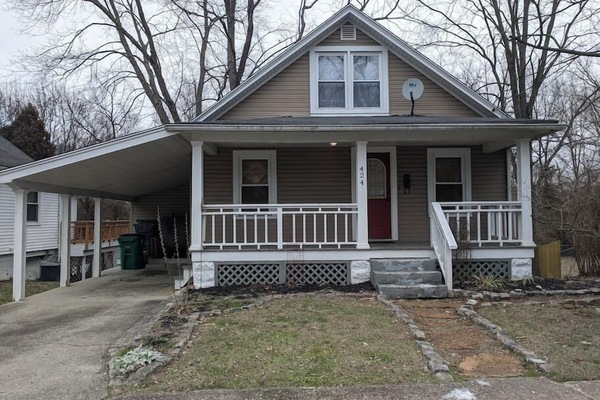 Front of house and carport.