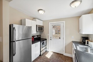 Fridge, microwave, oven, stovetop - Chestnut, Three Bedroom House in Historic Loveland (Loveland)