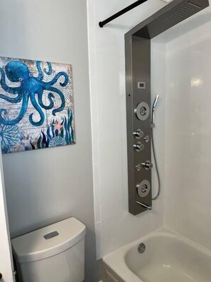 Bathtub, hair dryer, towels