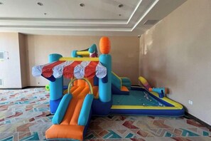 An indoor inflatable play area with slides and climbing structures. - Pegasus Hotel (Zhaosu)