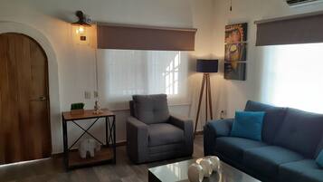 Superior Villa | Living area | 40-inch flat-screen TV with satellite channels, TV, Netflix