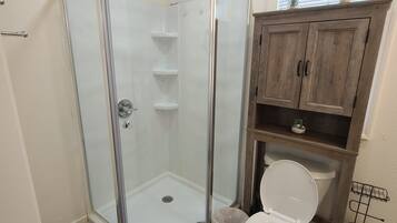 Shower, hair dryer, towels, toilet paper