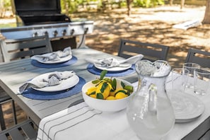 Enjoy al fresco dining in our garden, where a table for four is set with fine china and a refreshing pitcher of lemonade.