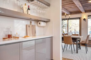 Enjoy meals in the kitchen with a wine cooler and stainless steel sink.