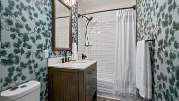 Combined shower/tub, hair dryer, towels, soap
