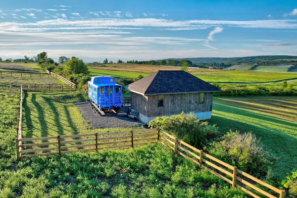 Welcome to The Caboose- A dream vacation in paradise with... drumroll please... Farm animals!