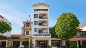 A multi-story hotel with a sign reading "NOI BAI BOUTIQUE HOTEL". - S79 Noi Bai Airport Hotel (Hanoi)