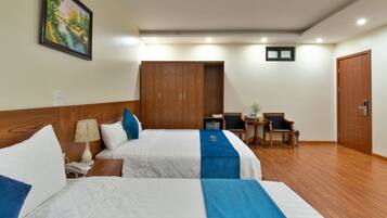 Family Quadruple Room, 2 Queen Beds, City View | Hypo-allergenic bedding, minibar, desk, laptop workspace