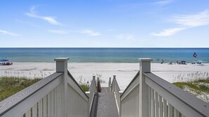 A wooden staircase leading to a beach with clear skies and calm waters. - A Gulf Dream - Gulf Front with Private Pool and Carriage House (Santa Rosa Beach)