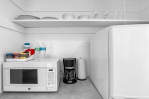 Enjoy a convenient kitchenette with a microwave, coffee maker, and refrigerator.