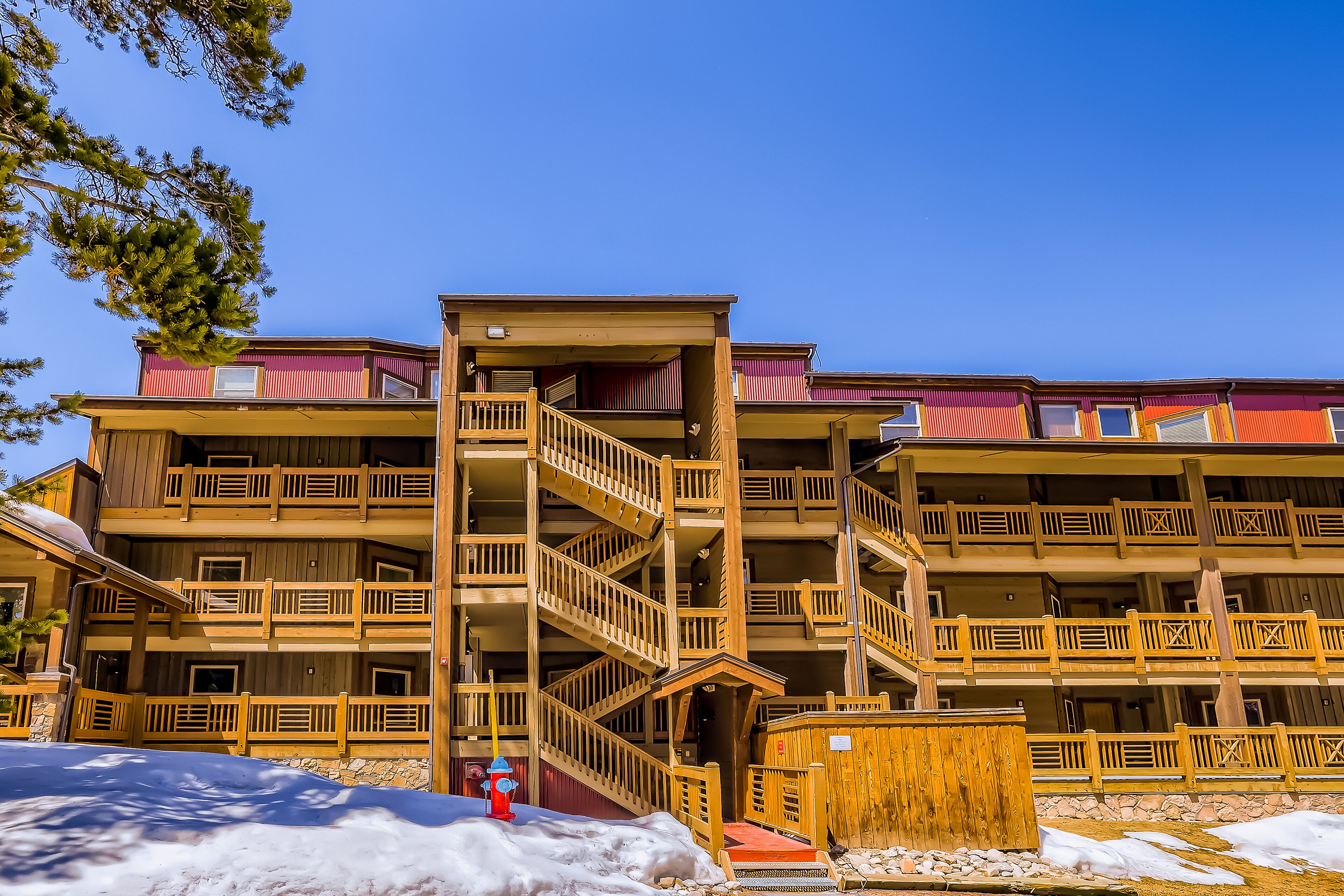 Convenient ski condo with pool, hot tub, grills, balcony & fireplace
