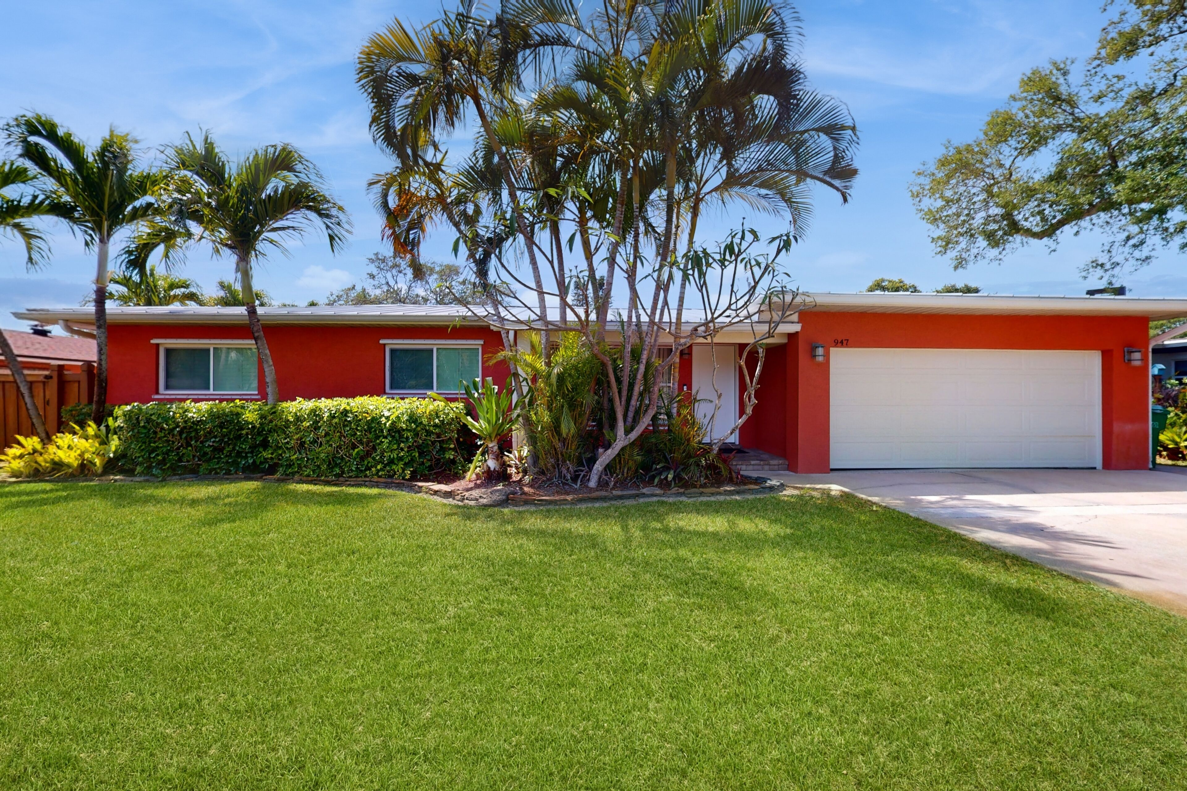 Tropical home with pool, lovely patio & game room - walk to beach