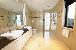 Deluxe Villa | Bathroom | Separate bathtub and shower, towels, shampoo, toilet paper