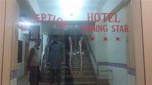 A hotel entrance with a staircase and a sign that reads "SEPTIC HOTEL". - Hotel Shining Star (Mekhtar)