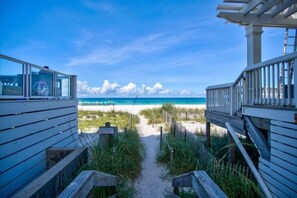 A beach pathway leading to the ocean with a wooden structure on the left and a white railing on the right. - Holiday Haven! 2-Min Walk to Sandy Beach! (Panama City Beach)