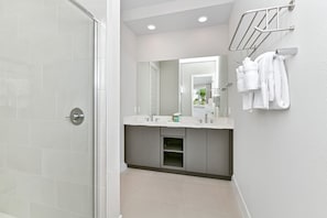 Shower, hair dryer, towels, soap