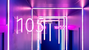 A neon sign with the number 105 in a modern, illuminated setting. - Graphik Montparnasse (Paris)