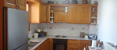 Villa | Private kitchen | Fridge, microwave, oven, stovetop