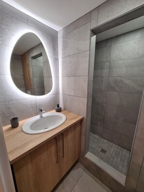 Shower, hair dryer, towels, soap