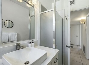 Bathtub, hair dryer, towels, soap