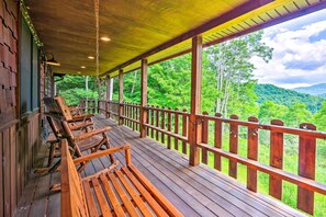 A wooden deck with benches overlooking a forested landscape. - Slaty Fork Escape w/ Mountain View + Hot Tub! (Slaty Fork)
