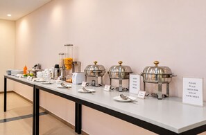 A buffet setup with various food stations, including a sign for egg dishes. - Enkay Residency Sector 15 (Gurugram)