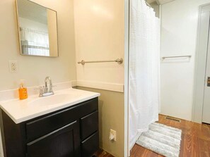 Combined shower/tub, hair dryer, towels, soap