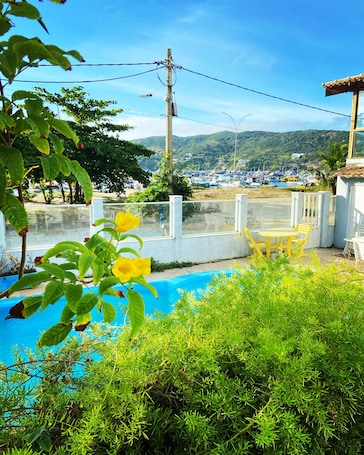Outdoor pool, open 8:00 AM to 9:00 PM, pool umbrellas