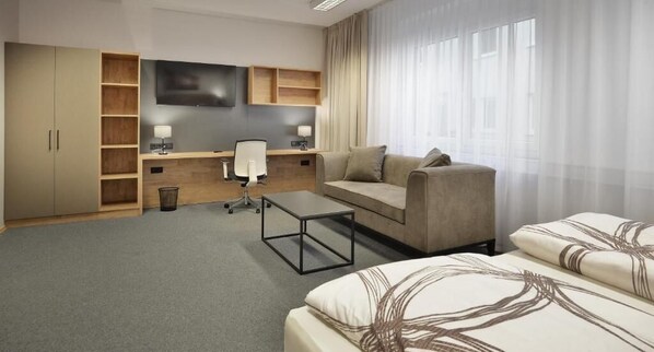 Desk, laptop workspace, free WiFi, bed sheets