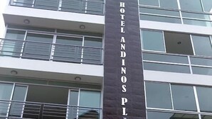 A multi-story building with a prominent vertical sign reading "HOTEL ANDINOS PLAZA". - Hotel Andinos Plaza (Pitalito)