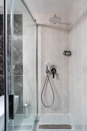 Shower, designer toiletries, hair dryer, slippers