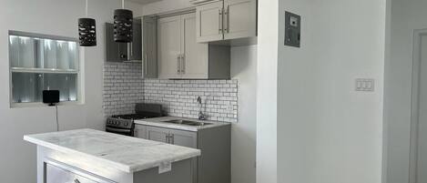 Fridge, microwave, stovetop, cookware/dishes/utensils