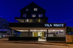 A two-story building with a sign reading "VILA WHITE". - Villa White (Trogir)