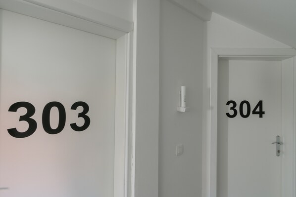 Two doors with numbers 303 and 304, indicating a hotel or apartment complex. - Villa White (Trogir)